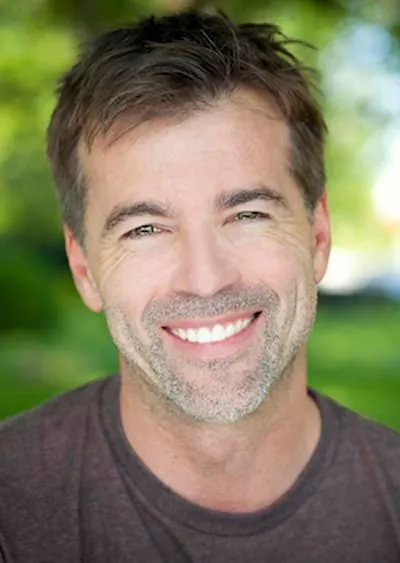 man smiling after getting dental implants at Southview Dental Care