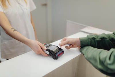 patient paying for his dental services at Southview Dental Care