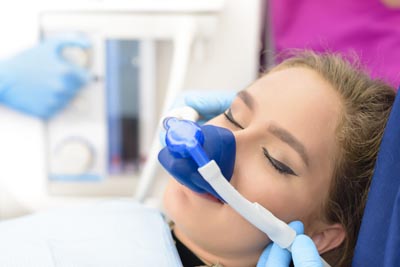 Southview Dental Care patient asleep during her dental procedure thanks to sedation dentistry